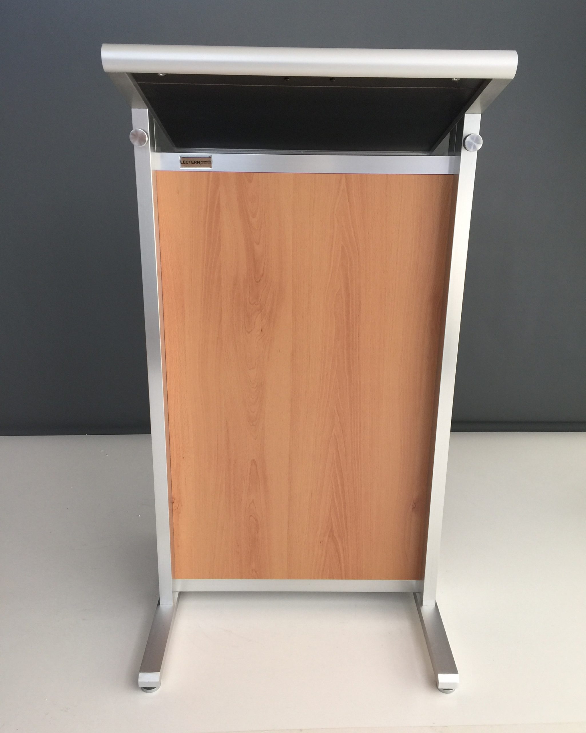 Modern lectern podium with wood panel front and silver aluminium frame
